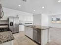 Spacious kitchen with an island, stainless steel appliances, and granite countertops at 40080 W Venture Rd, Maricopa, AZ 85138