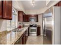 Updated kitchen with stainless steel appliances and granite countertops at 15095 N Thompson Peak Pkwy # 2082, Scottsdale, AZ 85260