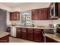 Modern kitchen with granite countertops and stainless steel appliances at 15095 N Thompson Peak Pkwy # 2082, Scottsdale, AZ 85260