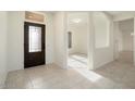Entryway with tile flooring and view to the living area at 15744 W Clear Canyon Dr, Surprise, AZ 85374
