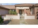 Inviting home exterior with landscaped yard and walkway at 15744 W Clear Canyon Dr, Surprise, AZ 85374