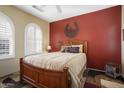 Guest bedroom with a wooden bed frame and southwest decor at 17346 W Alder Ln, Surprise, AZ 85387
