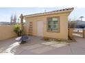 Private backyard patio with a storage shed and seating area at 17346 W Alder Ln, Surprise, AZ 85387
