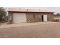 Detached garage with concrete slab and storage area at 30138 W Roosevelt St, Buckeye, AZ 85396