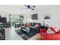 Open living area with gray sofa, red accent chair, and a coffee table at 5106 N 17Th Ave # 11, Phoenix, AZ 85015