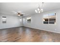 Spacious living room featuring hardwood floors and a ceiling fan at 9814 E Palladium Dr, Mesa, AZ 85212