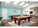 Game room with pool table and air hockey table at 10601 N 26Th Pl, Phoenix, AZ 85028