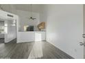 Kitchen with wood cabinets, laminate floor, and breakfast bar at 19601 N 7Th St # 2026, Phoenix, AZ 85024