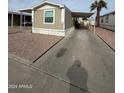 Mobile home with carport and paved driveway at 9431 E Coralbell Ave # 32, Mesa, AZ 85208