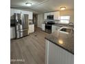 Modern kitchen with stainless steel appliances and granite countertops at 9431 E Coralbell Ave # 32, Mesa, AZ 85208