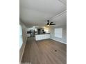 Open living room with wood-look floors and ceiling fan at 9431 E Coralbell Ave # 32, Mesa, AZ 85208