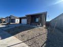 Single-story house with a landscaped front yard and a two-car garage at 17267 W Sunward Dr, Goodyear, AZ 85338