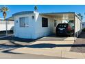 Mobile home exterior with carport and landscaping at 305 S Val Vista Dr # 204, Mesa, AZ 85204