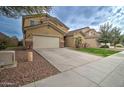 Two story house with a large yard and attached garage at 5659 S 239Th Dr, Buckeye, AZ 85326