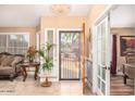 Bright and spacious entryway with tiled floors and French doors at 6722 W Piute Ave, Glendale, AZ 85308