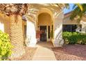 Front entry with arched entryway, security door, and walkway at 6722 W Piute Ave, Glendale, AZ 85308