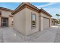 View of the home's side elevation, showcasing a garage and walkway at 15303 W Paradiso Ct, Surprise, AZ 85374