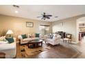 Spacious living room featuring two sofas, a coffee table and decorative accents at 21995 N 76Th Ln, Peoria, AZ 85383