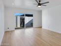 Living room features hardwood floors and a view of the backyard at 2415 N 71St St # D, Scottsdale, AZ 85257