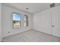 Bright bedroom with neutral walls and carpet flooring at 31867 N 130Th Ave, Peoria, AZ 85383