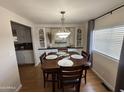 Bright dining area with built-in hutch and wood table at 4065 E University Dr # 373, Mesa, AZ 85205