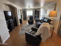 Living room with leather furniture and hardwood floors at 4065 E University Dr # 373, Mesa, AZ 85205