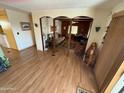 Open living area with wood floors and built-in shelving at 9501 E Broadway Rd # 269, Mesa, AZ 85208