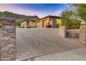 Long paved driveway leading to a beautiful home at 10030 N 23Rd St, Phoenix, AZ 85028