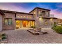 Elegant home exterior with stone and stucco detailing at 10030 N 23Rd St, Phoenix, AZ 85028