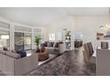 Spacious living room features tile flooring, and access to backyard at 12838 S 40Th Pl, Phoenix, AZ 85044