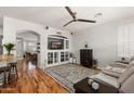 Living room with built-in entertainment center and cozy seating at 17221 N Thornberry Dr, Surprise, AZ 85374