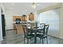 Kitchen with breakfast nook and a four-person dining table at 18048 W Spencer Dr, Surprise, AZ 85374