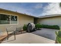 Backyard patio with seating and built-in grill at 18435 N 125Th Ave, Sun City West, AZ 85375