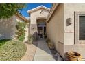 Inviting front entry with walkway and mature landscaping at 7782 E Wildcat Dr, Gold Canyon, AZ 85118