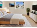 Virtually staged bedroom with wood bed frame and neutral decor at 1013 W Angela Dr, Phoenix, AZ 85023