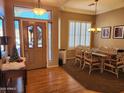 Dining room with hardwood floors, neutral walls, and a wood dining set at 1073 E Buena Vista Dr, Chandler, AZ 85249