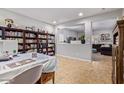 Bright office space with built-in shelving and view to living room at 30276 W Crittenden Ln, Buckeye, AZ 85396