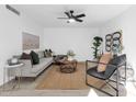 Spacious living room featuring a comfortable sofa and stylish decor at 5631 S Admiralty Ct # D, Tempe, AZ 85283