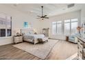 Bright main bedroom with a plush carpet, large windows, and ample space at 13037 E Jenan Dr, Scottsdale, AZ 85259