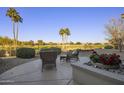 Spacious patio with seating area and golf course views at 17164 W Calistoga Dr, Surprise, AZ 85387