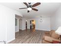 Open concept living space with hardwood floors and ceiling fan at 2890 E Fandango Dr, Gilbert, AZ 85298