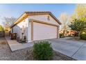 Attached two-car garage with a long driveway at 2949 W Kristina Ave, San Tan Valley, AZ 85144