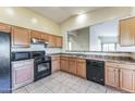 Spacious kitchen with wood cabinets, gas range and microwave at 2949 W Kristina Ave, San Tan Valley, AZ 85144