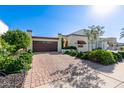 Spanish style home with a brick driveway and mature landscaping at 6317 E Pinchot Ave, Scottsdale, AZ 85251