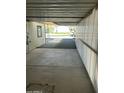 Covered carport area beside the mobile home at 9623 E Baywood Ave, Mesa, AZ 85208