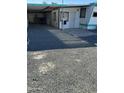 Gravel driveway leading to mobile home entrance at 9623 E Baywood Ave, Mesa, AZ 85208
