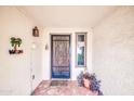 Front entry with wrought-iron door and terracotta tile flooring at 2110 W Silvergate Dr, Chandler, AZ 85224