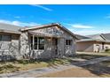 Another view of a charming single-story home with a well-maintained lawn at 225 N Standage -- # 40, Mesa, AZ 85201