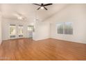 Bright living room featuring hardwood floors and access to backyard at 3002 W Mohawk Ln, Phoenix, AZ 85027