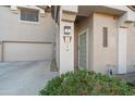 Front entrance with landscaping and attached garage at 7999 W Mary Jane Ln, Peoria, AZ 85382